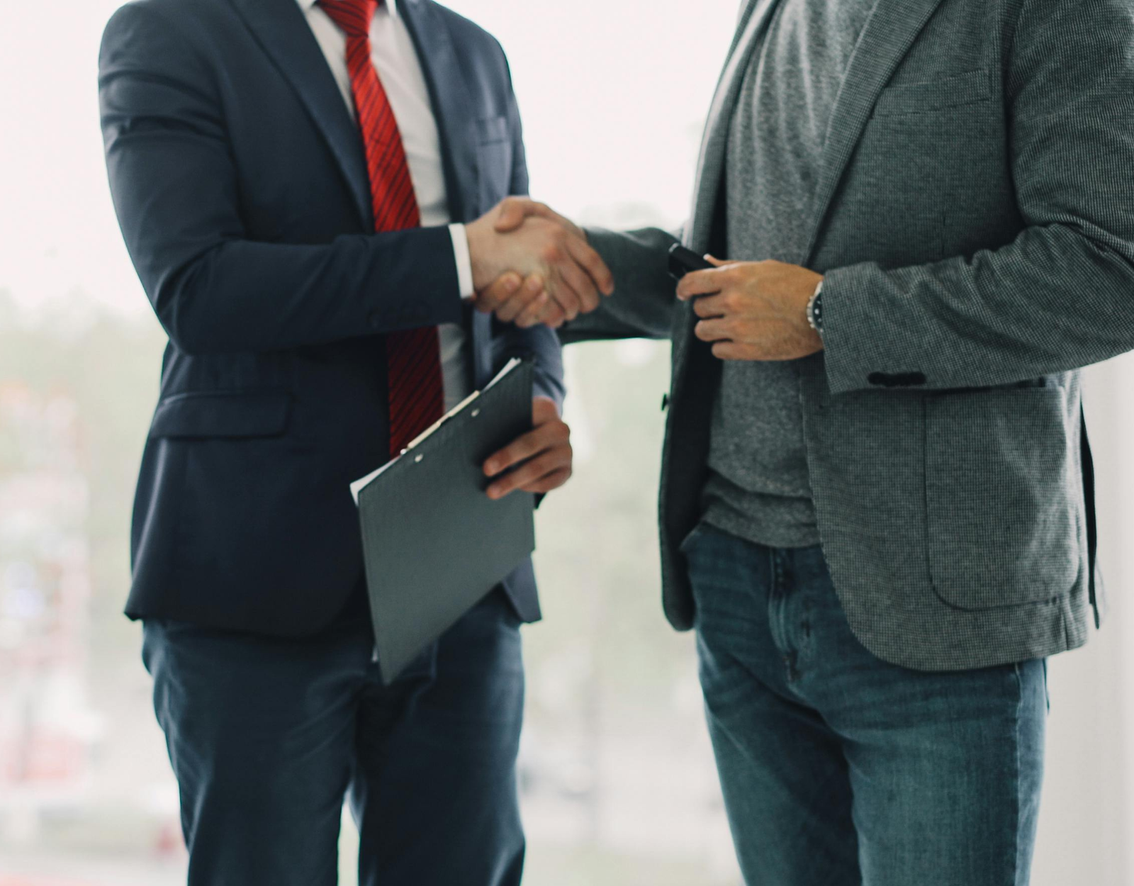 Facility manager shaking hands with a Gold Keys representative after a site visit