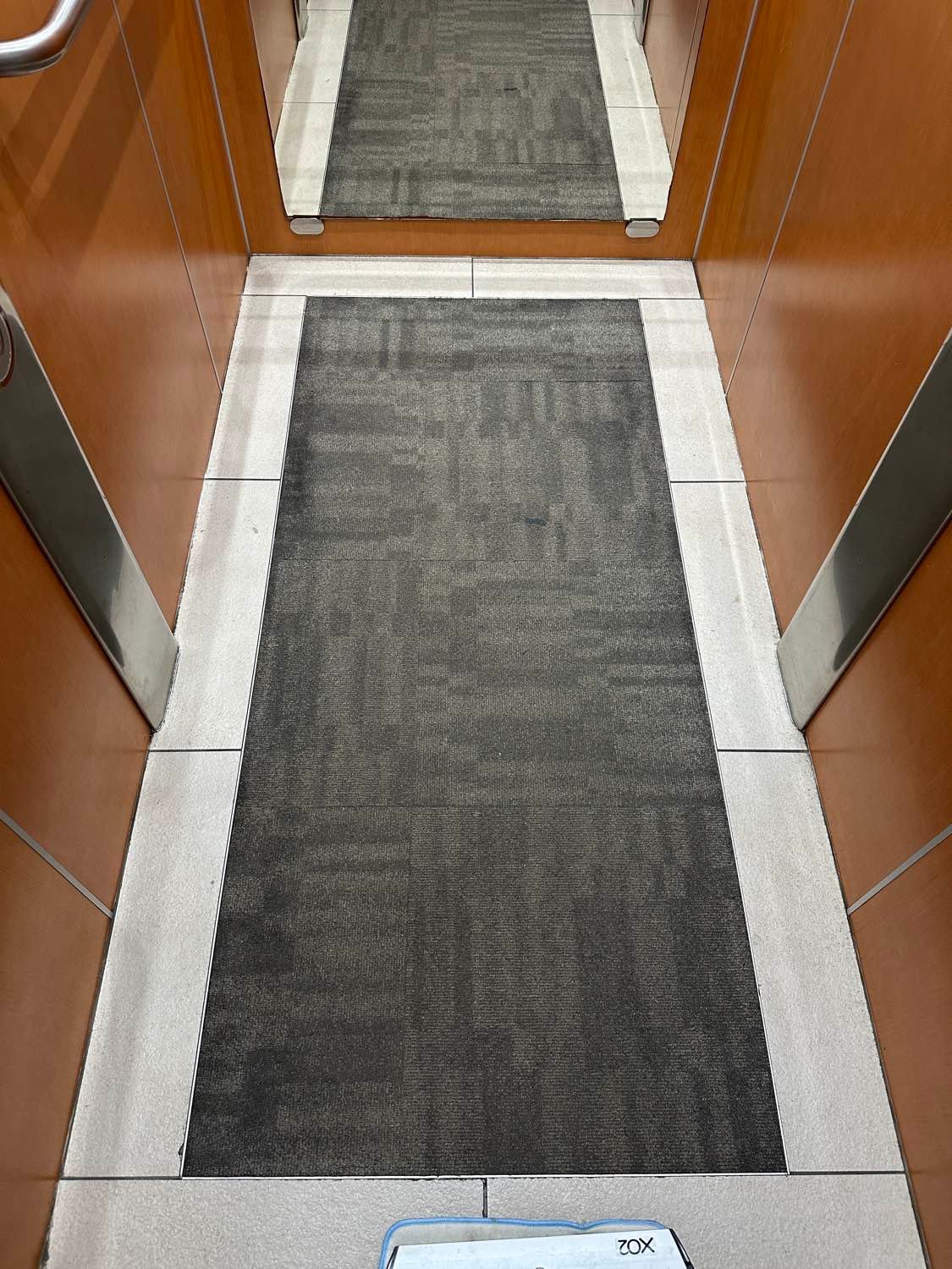 Clean lift floor and stainless steel in a Gold Coast strata building
