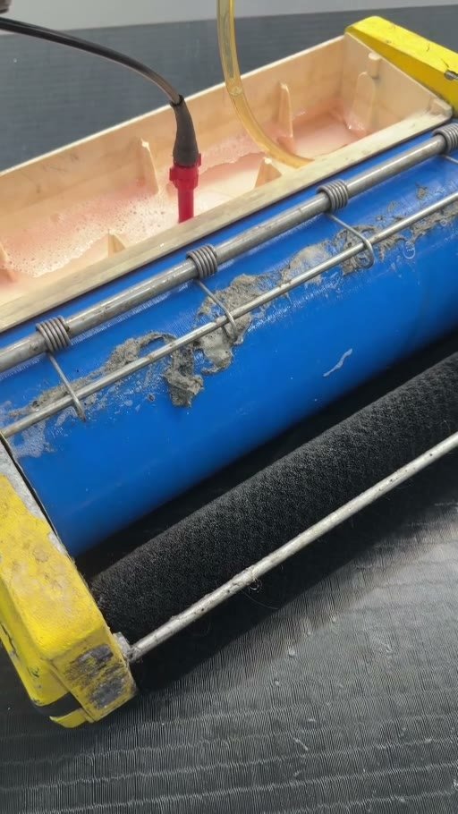 Grime collected by the scrubbing brushes during a jiu jitsu mat deep clean